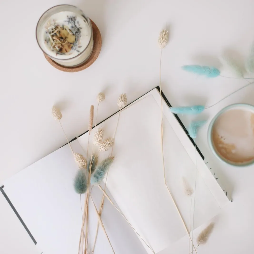 Blank paper sheet, coffee cup and dry flowers on white background. Minimal home workspace desk table. Flat lay, top view, mockup with copy space. Blank paper sheet, coffee cup and dry flowers on white background. Minimal home workspace desk table. Flat lay, top view, mockup with copy space
